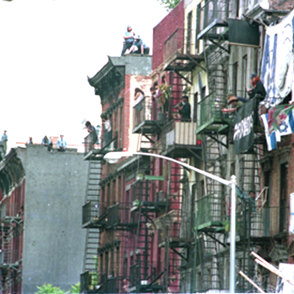 building with umbrellas during a police siege